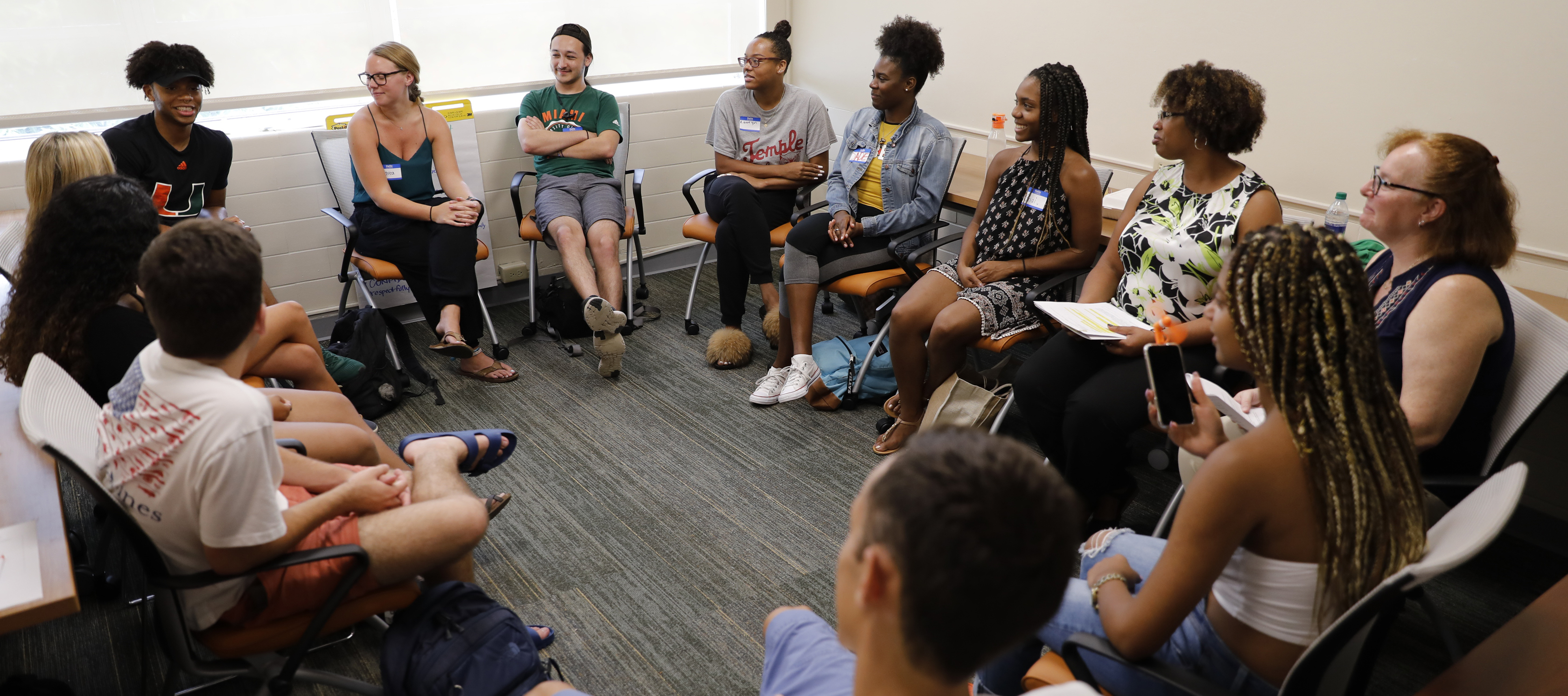 Students sitting in a circle engaged in discussion