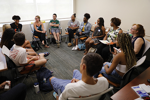 Students sitting in a circle engaged in discussion